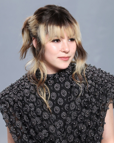 Closeup of Andi Tóth with the bleach cutout hair trend.