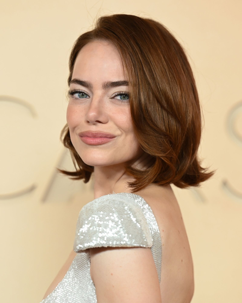 Closeup of Emma Stone with the burnt sienna hair trend.